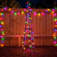 Load image into Gallery viewer, Garden scene with potted plants and a wooden fence
